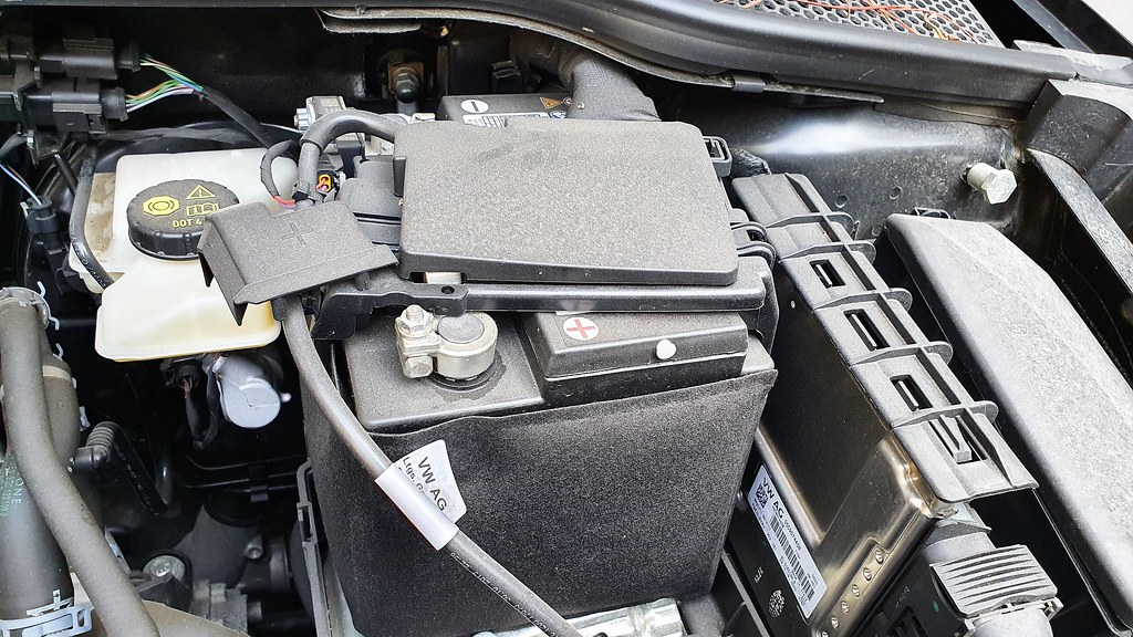Car battery fitted in an engine bay